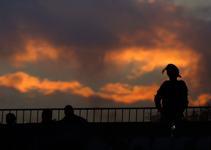 Illustration for article titled Smoke, Flares, Riot Police In Belgrade Derby Make For Haunting Photos